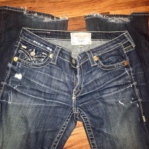 Boot cut destroyed vintage jeans